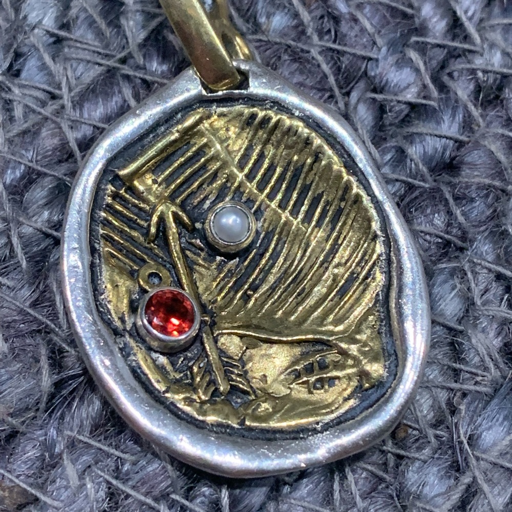 Waxing poetic waxy assemblage arrow pendent retired